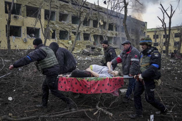 Wounded pregnant woman, being evacuated from maternity hospital after the bombing 